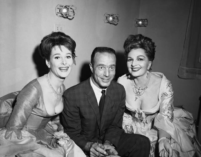 Scott Carpenter shown back stage at the Royale Theatre, New York on Nov. 7, 1963 where the David Merrick, London hit ?The Rehearsal? is playing. The entire company of the show is English. The members of the cast with the noted astronaut are from left to right: Adrienne Corri, Scott Carpenter and Coral Browne.