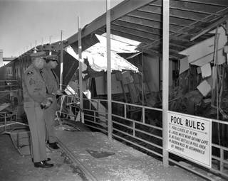 Las Vegas police officers look at destruction of the Orbt Inn hotel January 7, 1967. Richard James Paris, a 28-year-old Army deserter, committed suicide by firing a handgun into a pile of dynamite, also killing his wife Christine, John and Lillian Auwaerter from California and newlyweds George and Arnell Brooks from Arizona. Photo by Ken Jones