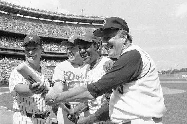 In this Aug. 23, 1980, file photo, Hall of Famers from left, Roger Maris, Duke Snider, Willie Mays and Ralph Kiner, pose for pictures before the annual New York Mets Old Timers Day at Shea Stadium in New York. The baseball Hall of Fame says slugger Ralph Kiner has died. He was 91. The Hall says Kiner died Thursday, Feb. 6, 2014, at his home in Rancho Mirage, Calif.