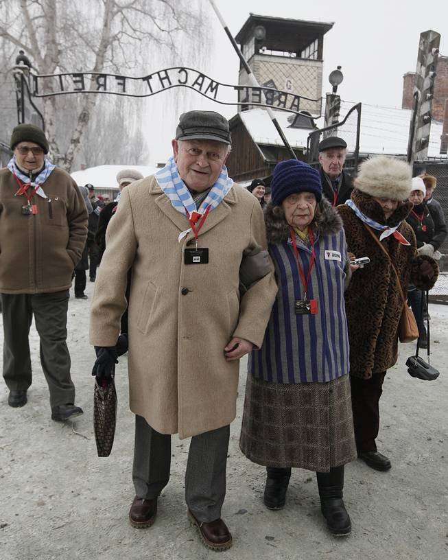 Holocaust survivors arrive for a ceremony to mark the 69th anniversary of the liberation of Auschwitz Nazi death camp's in Oswiecim, Poland, on Monday, Jan. 27, 2014, since the Soviet Red Army liberated the camp. Israeli lawmakers and government officials are to attend anniversary observances later in the day.