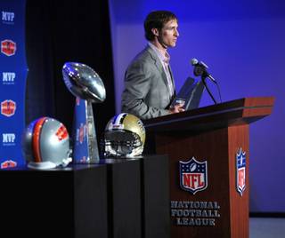 New Orleans Saints quarterback Drew Brees receives the Super Bowl XLIV MVP Award at the NFL Media Center in Ft. Lauderdale, Fla., on Feb. 8, 2010. NFL Commissioner Roger Goodell made the presentation, and Saints coach Sean Payton also attended the ceremony.