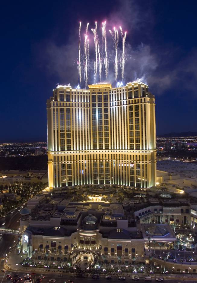 Fireworks shoot from the roof of the Palazzo Resort during the grand opening of the $1.9 billion hotel-casino in Las Vegas, Nevada January 17, 2008. The Palazzo and Venetian (not in picture) complex represents the world's largest integrated destination resort, with 7,128 hotel rooms and 2.3 million square feet of meeting, convention and exhibition space.