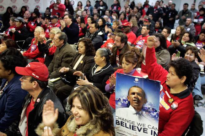 Culinary members clap and cheer during a caucus day rally and informational meeting at the Culinary Union Local 226 headquarters in Las Vegas early in the morning Saturday, January 19, 2008.