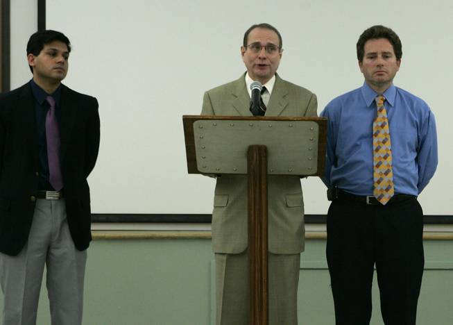 Endoscopy Center of Southern Nevada doctors Sanjay Nayyar, left, and Clifford Carrol flank fellow doctor Eladio Carrera as he reads a statement during a news conference at the health district Wednesday, February 27, 2008. The Southern Nevada Health District is notifying about 40,000 former patients of the Endoscopy Center of Southern Nevada that they may have been exposed to hepatitis C.