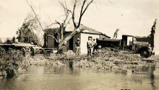 A salvage party dismantles a house in St. Thomas, Nevada in 1942. St. Thomas, which was abandoned to the rising waters of Lake Mead in 1938, has resurfaced due to fluctuating lake levels several times over the decades.