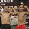 WBC super featherweight champion Juan Manuel Marquez, left, of Mexico and Manny Pacquiao of the Philippines flex during their weigh-in Friday at the Mandalay Bay Events Center. Pacquiao says their bout will be his last in this division. WBC super featherweight champion Juan Manuel Marquez, left, of Mexico and Manny Pacquiao of the Philippines flex during their weigh-in Friday at the Mandalay Bay Events Center. Pacquiao says their bout will be his last in this division.