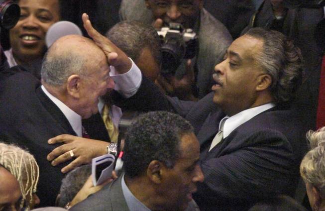 In this file photo of Monday, March 17, 2008, before a swearing in for ceremony for New York Gov. David Paterson at the Capitol in Albany, the Rev. Al Sharpton, right, touches the brow of former New York Mayor Ed Koch, who once battled Sharpton but now calls him a friend and a "bona fide leader." Of New York City's most prominent civil rights leader, Koch says, "He used to be a demagogue. I don't think he is anymore".