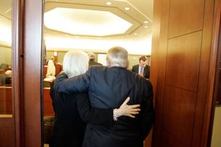 Las Vegas Sands Corp. Chairman Sheldon Adelson, right, is assisted by his wife Miriam walking into District Court Thursday, April 17 for a trial resulting from a lawsuit by Hong Kong businessman Richard Suen. 