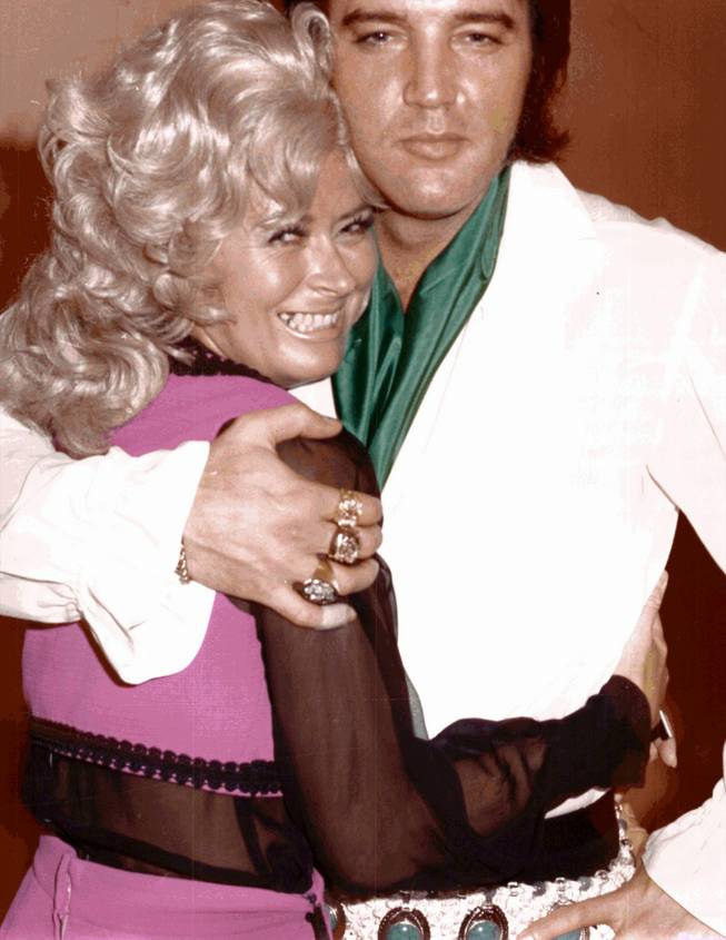 Janie Steele hugs Elvis Presley in this 1960s photo. Steele has retired after nearly 30 years at the Hilton, where she worked in photography and bookkeeping.