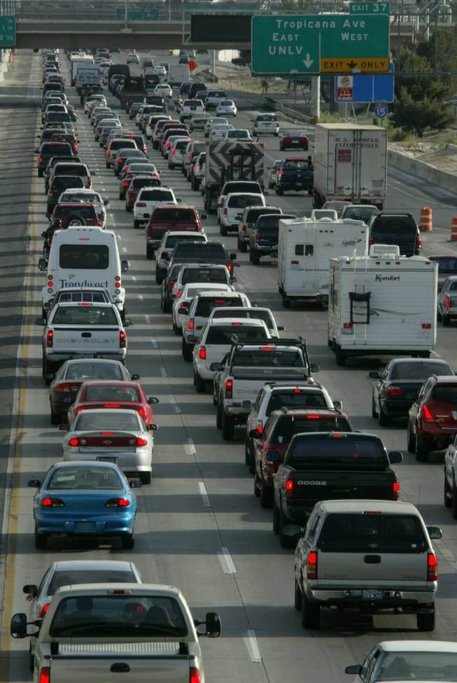 Motorists navigate rush hour traffic on Interstate 15 in Clark County. Rep. Jon Porter, who opposed tougher fuel efficiency standards two years ago, more recently has taken the position that Congress should act against global warming.