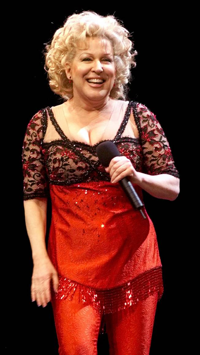 Bette Midler smiles at the audience during her performance at the Mandalay Bay Events Center, Friday, Dec. 31, 1999. This would be the second to last performance of her "Divine Miss Millennium" tour, which was timed to end on the first day of the New millenium Jan. 1, 2000. 