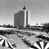 The Sahara's 14-story tower rises out of the desert as guests lounge around the pool in this 1960s photo. Real estate developer Del Webb bought the property from Milton Prell in 1961 and orchestrated a $100 million merger between his construction company and the California-Sahara Corp., creating the first publicly traded company to own casinos. The Sahara's 14-story tower rises out of the desert as guests lounge around the pool in this 1960s photo. Real estate developer Del Webb bought the property from Milton Prell in 1961 and orchestrated a $100 million merger between his construction company and the California-Sahara Corp., creating the first publicly traded company to own casinos.