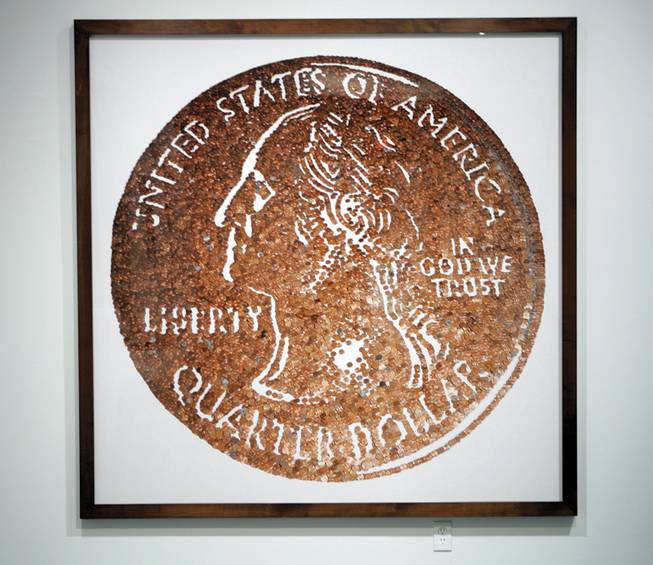 "Monads (Small Change)," a Cibachrome print by Vik Muniz, is on loan from the collection of Frank and Jill Fertitta for the exhibit. 
