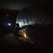 Photo: A graffiti artist paints by flashlight. Photo: A graffiti artist paints by flashlight.