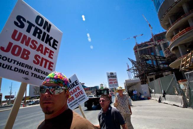 Construction workers picket in front of MGM Mirage's CityCenter Tuesday afternoon in protest of safety conditions for the $9.2 billion project. The strike, which started late Monday night in reaction to the deaths of 11 workers on Strip projects over the last year and a half, ended when union leaders and contractor Perini Building Co. reached an agreement on improved safety conditions.