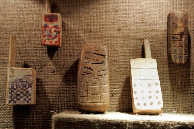 Play provides refugee children a temporary escape from daily life. These toy cell phones were made from wood and clay by Sudanese and Congolese children in a refugee camp in Uganda. 
