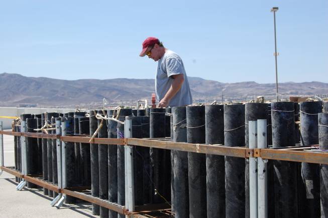 A Grucci fireworks technician preps for one of five Fourth of July shows at the Sunset Station Casino in Henderson, NV.  Over 60 hours of preparation goes into the nine minute Grucci fireworks display each year. 