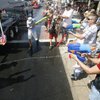 Photo: People spray water on each other during the 60th a