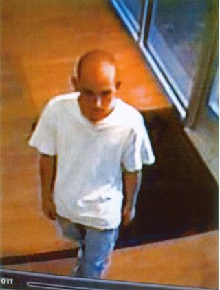 Surveillance video image of an attempted robbery suspect.