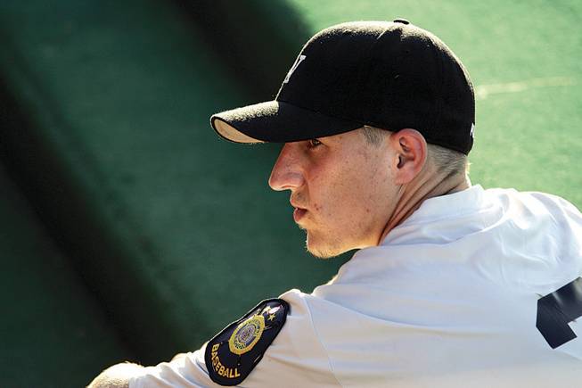 Las Vegas Post 40 pitcher-outfielder Alex Steward, sitting in the dugout during Saturday's game, sports the embroidered shoulder patch that long has identified American Legion ballplayers.
