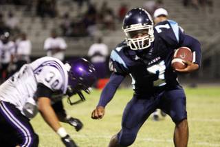 Centennial running back Brandon Wright, right, attempts to keep away from Durango linebacker Carlos Moreno during the season opener at Centennial High School.