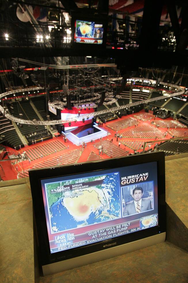 Television monitors track the progress of Hurricane Gustav as workers prepare for the opening of the Republican National Convention on Sunday in St. Paul. Sen. John McCain and the RNC have announced that all programs beyond official business will be canceled, at least Monday, to focus on the potential natural disaster. 
