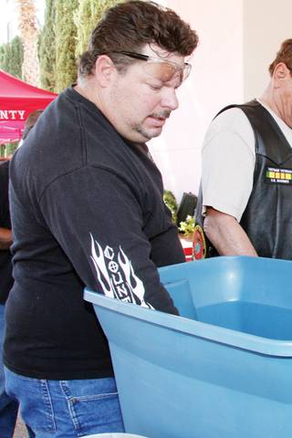David Quartaro, of Las Vegas, draws a number in order for the highest poker hand. Quartaro was participating in a 50-mile poker run sponsored by the Las Vegas chapter of the Hells Angels.