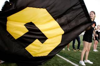Angellia Smith, the captain of the Clark High School cheerleading squad, holds a flag before the start of their game against Rancho High School at Clark High School in Las Vegas  Friday, September 5, 2008. Rancho won the game 21-20 with a two-point conversion in the last 60 seconds.
