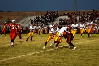 Del Sol's Tayiib Dauda takes down Chaparral's Pierre Jones during the first quarter of Friday's game.