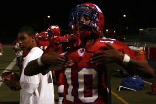Valley's Gidion Tesfai celebrates a teammate's touchdown during Friday's game against Liberty.