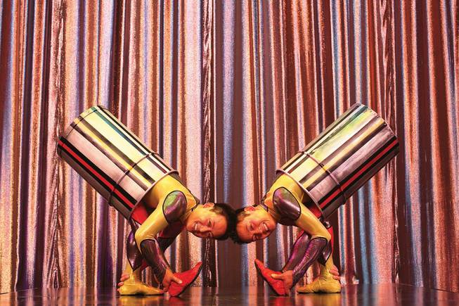 
At the Tropicana's Tiffany Theatre, Chinese-American twin contortionists Jun, left, and Bing Long entertain in "Folies Bergere."