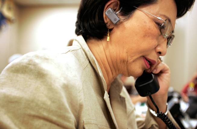 McCain-Palin campaign volunteer Julie Hereford works the phones this week at a Republican field office in Henderson. Admiration for the vice presidential candidate has attracted many new campaign workers. 
