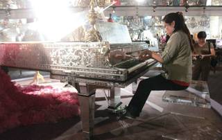 Grace Kim, 14, plays a piece on one of Liberace's pianos at the Liberace Museum on Sept. 3. A student at Las Vegas Academy, Kim is competing in the Liberace Piano Competition.