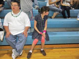 From left to right, Green Valley's Matt Cutler and Taylor Little rest after shaking it up on the dance floor during a dance for special program kids at Foothill High School on Sept. 26.