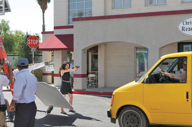 Mexican actress Barbara Mori, left, moves into action during the taping of "Kites" while on location Sept. 30 with Bollywood's reigning heartthrob actor, Hrithik Roshan, at Wyoming Street and Avenue B. 
