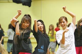 During break from class, Tokyo Dance & Actors School students -- from left, Eri Hirota, Emi Matsuo and Mika Sasaki -- strike dance poses while training at Fern Adair Conservatory for the Arts Oct. 1.