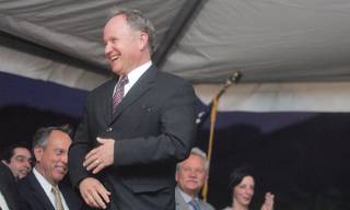 Michael Wixom, a member on the Board of Regents, laughs as he makes his way to the podium to give a short speech during the opening ceremony of Nevada State College's new Liberal Arts and Sciences building Thursday.