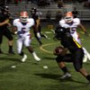 Clark running back Quincy Hatcher tries to dodge Gorman defenders Alex Turner (5) and Evan Palelei (55) on Oct. 3. Turner and Palelei are two of the most sought after defensive recruits for the class of 2010.
