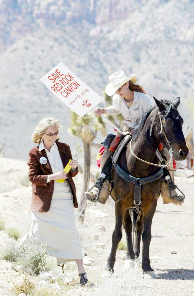 State Sen. Dina Titus, left, talks with Gina Mamusia before speaking at a rally in 2003 to save Red Rock Canyon. Titus is widely credited with leading the fight fight to protect the canyon. Her other accomplishments include saving a 2005 comprise property tax cap.