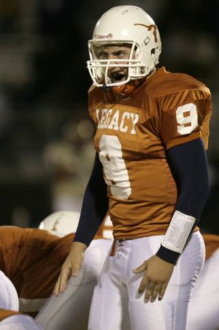 Legacy quarterback Zach Monticelli calls a play from the line of scrimmage at Friday night's game against Cheyenne.