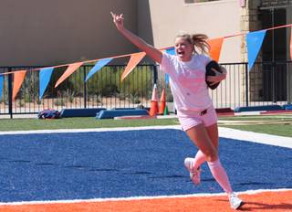 Bishop Gorman senior Julia Tucker celebrates as she scores a touchdown during the powderpuff game against the freshmen girls Oct. 5.