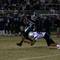 Photo: Liberty's Ian Jackson (8) tackles Green Valley's D Photo: Liberty's Ian Jackson (8) tackles Green Valley's D