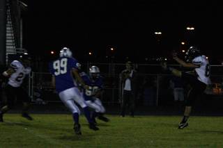 Las Vegas' Trevor Lowe (80) kicks the ball off to Basic during the fourth quarter of Friday's game.