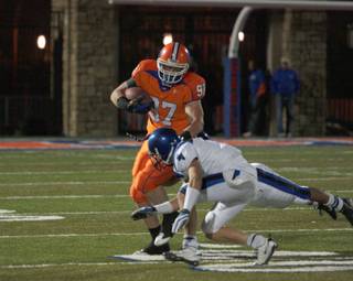 Bishop Gorman defensive end Justin Chaisson (97) barrels over a Sierra Vista player at the Gaels' homecoming game on Oct. 10.