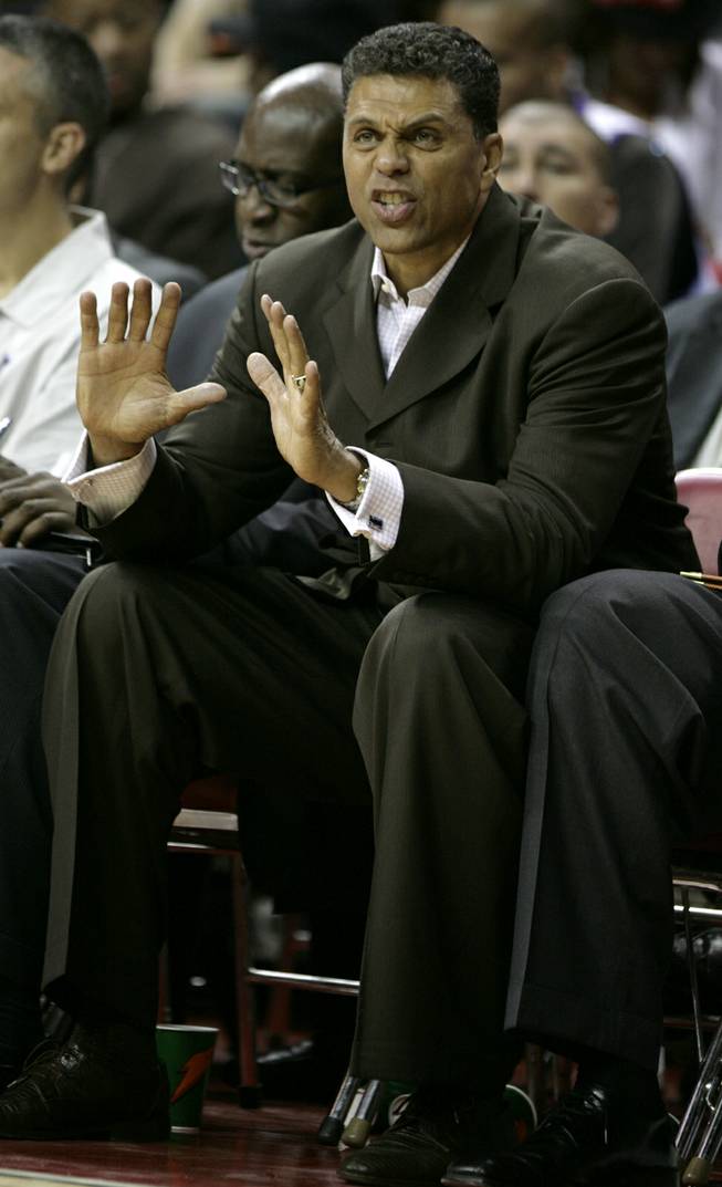 Kings head coach Reggie Theus, a UNLV legend, signals instructions during an exhibition game between Sacramento and the Los Angeles Lakers at the Thomas & Mack Center.	