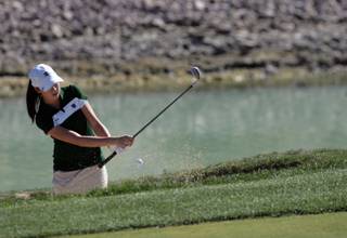 Green Valley's Jordan Sala hits her ball out of a sand trap during the Sunrise Golf Tournament at Silverstone Golf Club on Tuesday.