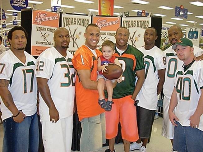 Members of the Las Vegas Kings of the Labelle Community Football League visit with fans at Nellis Air Force Air Force base. The players are from left to right, Byron Wilson, John Travis, Richard Mapp, Prentice Caesar, Johnny Young, Moarco Manzy and Scott Piper.