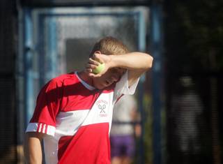 Coronado's Colton Pate wipes sweat from his brow during Friday's Sunrise Region tennis final against Green Valley's Evan Song at the Amanda and Stacy Darling Memorial Tennis Center. Song took the win.  

