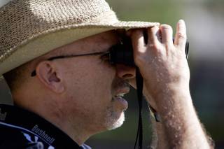 Golf fan Bob Savitsky of Phoenix watches golfer Robert Garrigus hit from the fairway during the Justin Timberlake Shriners Hospitals for Children Open at TPC Summerlin on Friday, October 17, 2008. 