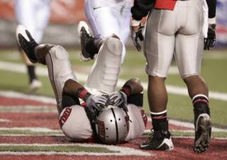 UNLV defensive back Geoffery Howard covers his face after getting beat for a touchdown during the first half against Air Force at Sam Boyd Stadium. 